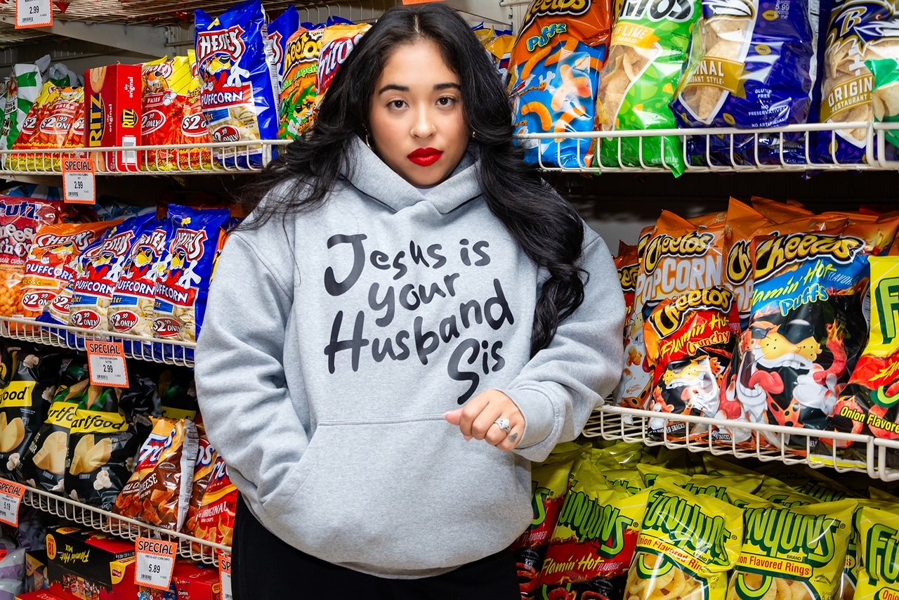Bella Veronica in the grey Jesus Is Your Husband, Sis hoodie.